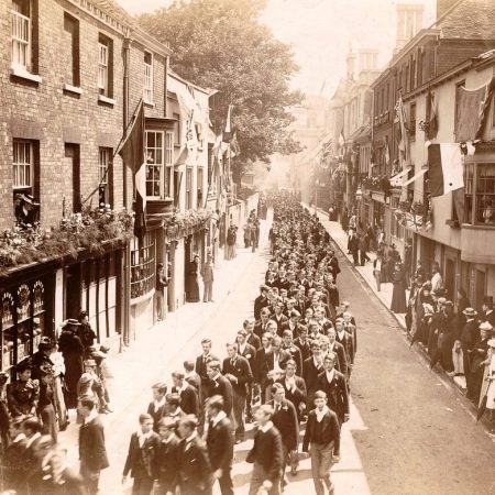 Photograph of boys processing along College Street to attend a service in Winchester Cathedral on the occasion of the 5th Centenary of Winchester College in 1393, ref: J4/1/38